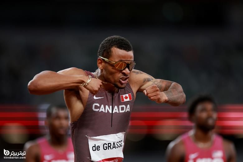 آندره د گراس از کانادا پس از کسب طلا در فینال 200 متر مردان جشن گرفت