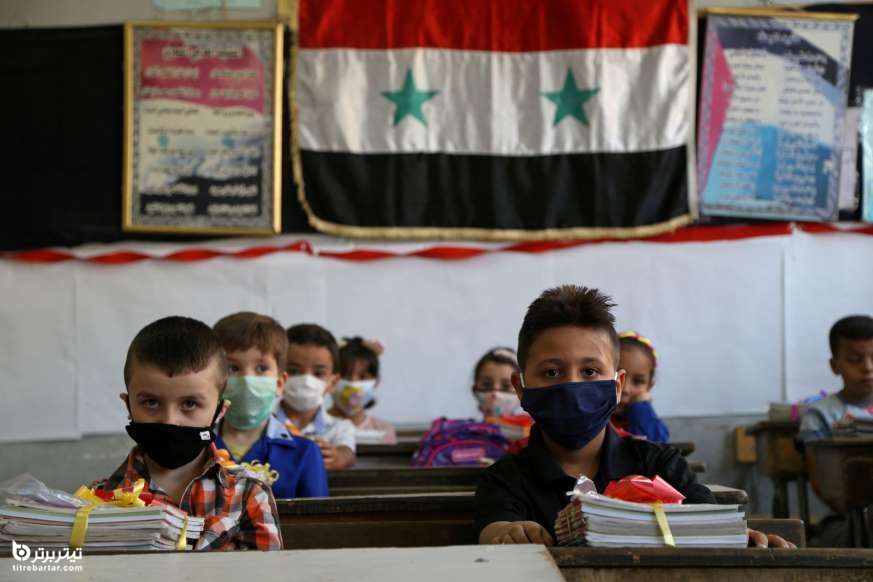 دانش آموزانی که از ماسک های محافظ صورت استفاده می کنند، سوریه