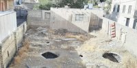 والی، محاصره در بین ساختمان‌های بلند و کوتاه