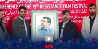 بوسه فرزند شهید محمود باقری بر تابلوی نقاشی پدرش
