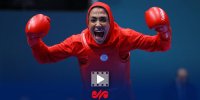 سلام نظامی «سهیلا منصوریان »هنگام اهدای مدال قهرمانی