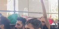 پیچیده شدن پیکر شهید خردسال با پرچم ایران + ویدئو