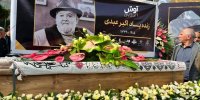 عکس | اولین تصویر از تابوت مرحوم اکبر عبدی با پرچم یا قمر بنی هاشم (ع)