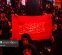 پرچم گردانی زائران ایرانی در مسیر پیاده‌روی اربعین